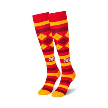 red and yellow knee-high socks with a repeating pattern of diamonds and stripes. great for men and women.   
