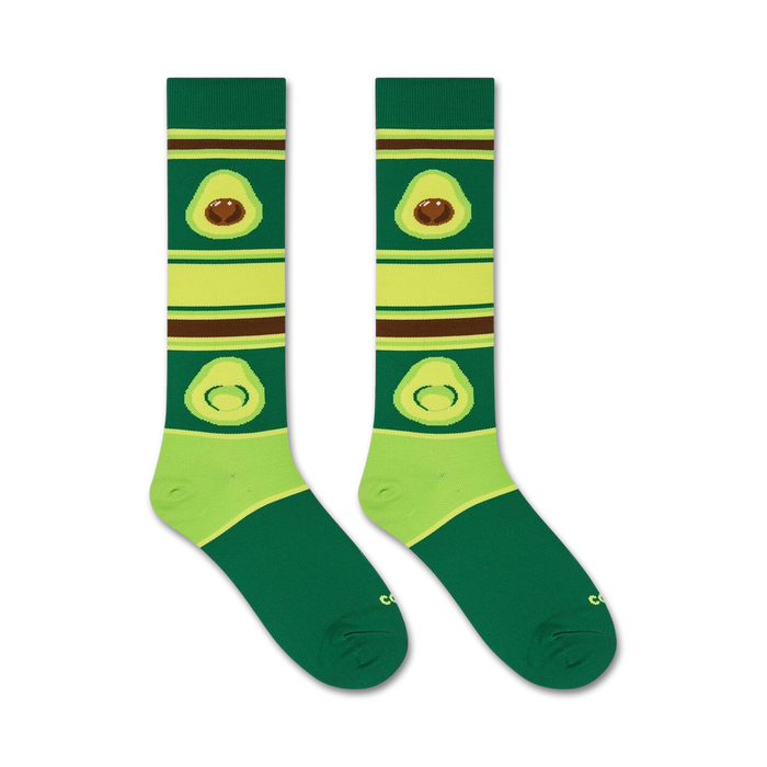 A pair of green socks with brown and avocado-patterned stripes.