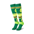 Pair of knee-high socks with avocados and stripes in green, lime, and brown. Fun and quirky design.