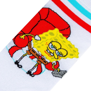 A white sock with a red and blue striped cuff. The sock features a cartoon character, SpongeBob SquarePants, sitting in a red armchair.