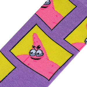 A close up of a pair of purple socks with a repeating pattern of cartoon character Patrick Star in yellow squares.