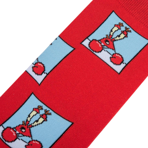 A red sock with a repeating pattern of a blue square with a cartoon crab on it.