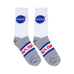 Flat lay of white and grey crew socks showing the blue NASA meatball logo on the upper and red NASA text on the foot part.