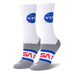 White crew socks on foot forms featuring the blue NASA meatball logo on the calf and red NASA worm text on a grey foot base.