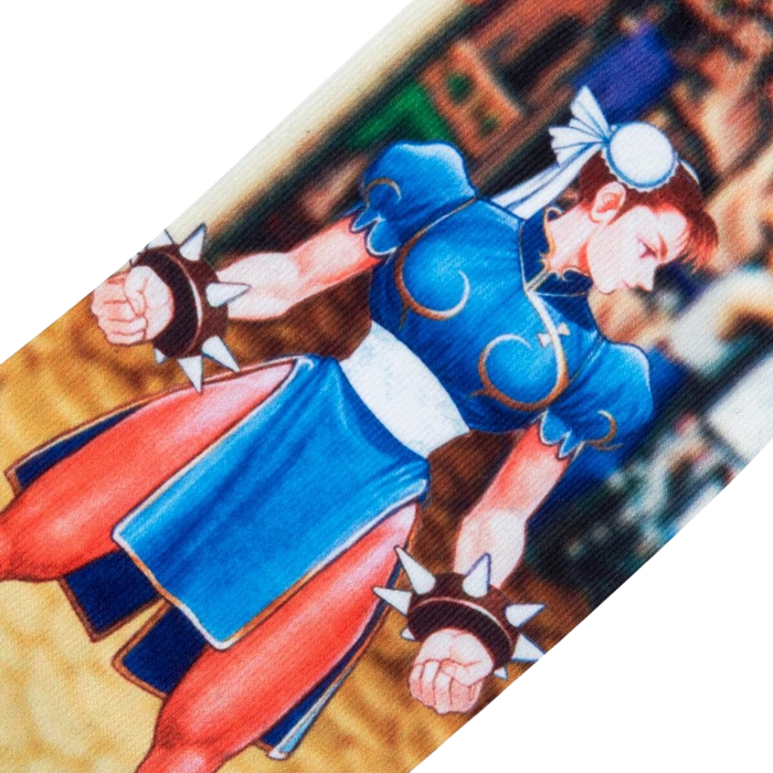 Chun Li, a character from the Street Fighter video game series, is depicted in this image. She is wearing her classic blue and white outfit and is in a fighting stance. The image is cropped at the waist.