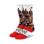 Crew socks with a white background featuring various WWF wrestlers and the WWE logo on red stripes. 