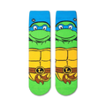 Pair of TMNT Leonardo crew socks laid flat, showcasing the full design.