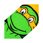 Close-up detail shot showcasing the texture and colors of Michelangelo's face on the TMNT socks.