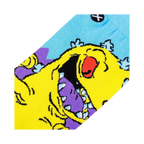 Close-up detail shot of the Rugrats Reptar sock design, highlighting the vibrant yellow, purple, and light blue colors.