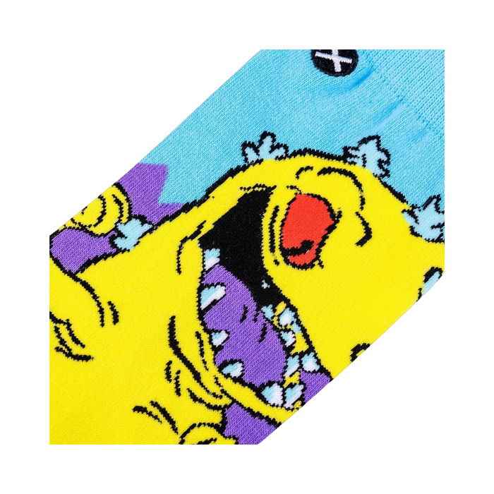 Close-up detail shot of the Rugrats Reptar sock design, highlighting the vibrant yellow, purple, and light blue colors.