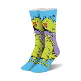 crew length blue and purple socks with a cartoon green dinosaur with sharp teeth, inspired by the rugrats reptar character.  