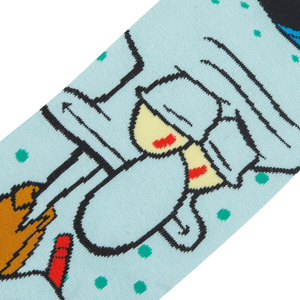 A close up of a pair of socks with a light blue background and a cartoon character, Squidward Tentacles from Spongebob Squarepants, with his eyes rolled up and to the side in exasperation.