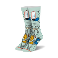Crew socks in teal featuring Squidward Tentacles from Spongebob Squarepants. He's depicted holding a notebook, wearing his signature hat, on a teal background with white polka dots.