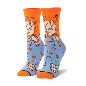 Pair of Chucky 'Good Guys' crew socks. Orange cuffs, blue body with Chucky image and knife pattern.