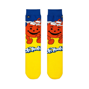 Flat front view of Kool-Aid crew socks with a blue cuff, smiling red pitcher, yellow foot, and the Oh Yeah catchphrase.