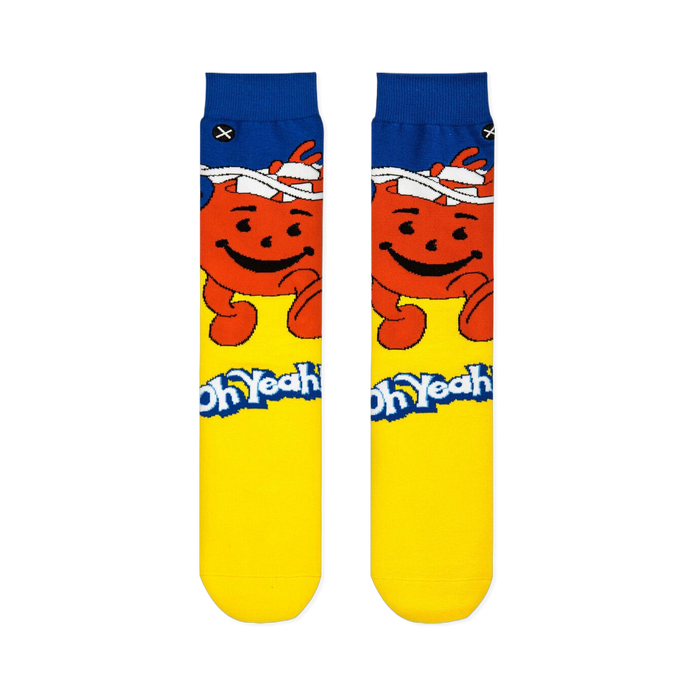 Flat front view of Kool-Aid crew socks with a blue cuff, smiling red pitcher, yellow foot, and the Oh Yeah catchphrase.
