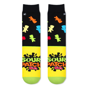 Flat lay of two socks showing the black top with colorful candy shapes and the bright yellow foot with the Sour Patch logo.