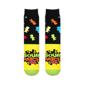 Flat lay of two socks showing the black top with colorful candy shapes and the bright yellow foot with the Sour Patch logo.