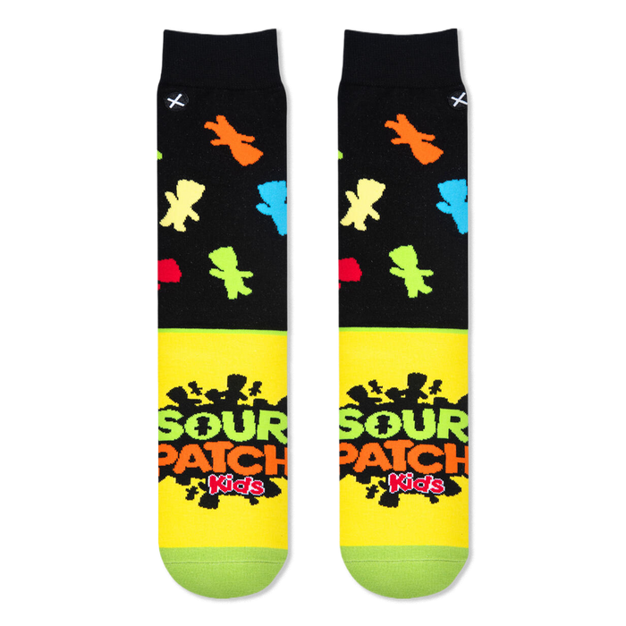 Flat lay of two socks showing the black top with colorful candy shapes and the bright yellow foot with the Sour Patch logo.