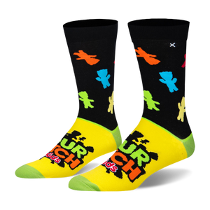 Crew socks with a black top featuring neon candy silhouettes, a yellow foot with the Sour Patch Kids logo, and green toes.