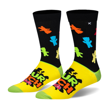 Crew socks with a black top featuring neon candy silhouettes, a yellow foot with the Sour Patch Kids logo, and green toes.