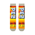 Flat lay of two Pez socks showing orange and yellow stripes, vertical block logos, and printed net weight details at the toe.