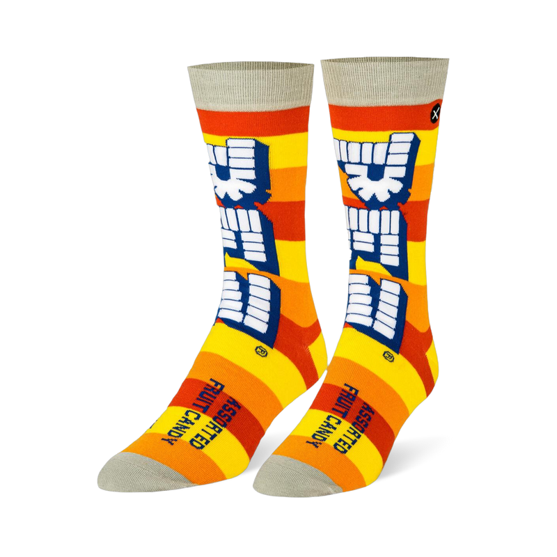 Crew socks with yellow and orange stripes, a large vertical white Pez logo, and light grey details on the toe and cuff.