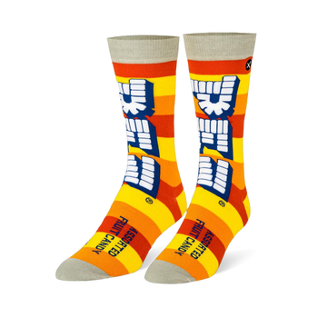 Crew socks with yellow and orange stripes, a large vertical white Pez logo, and light grey details on the toe and cuff.