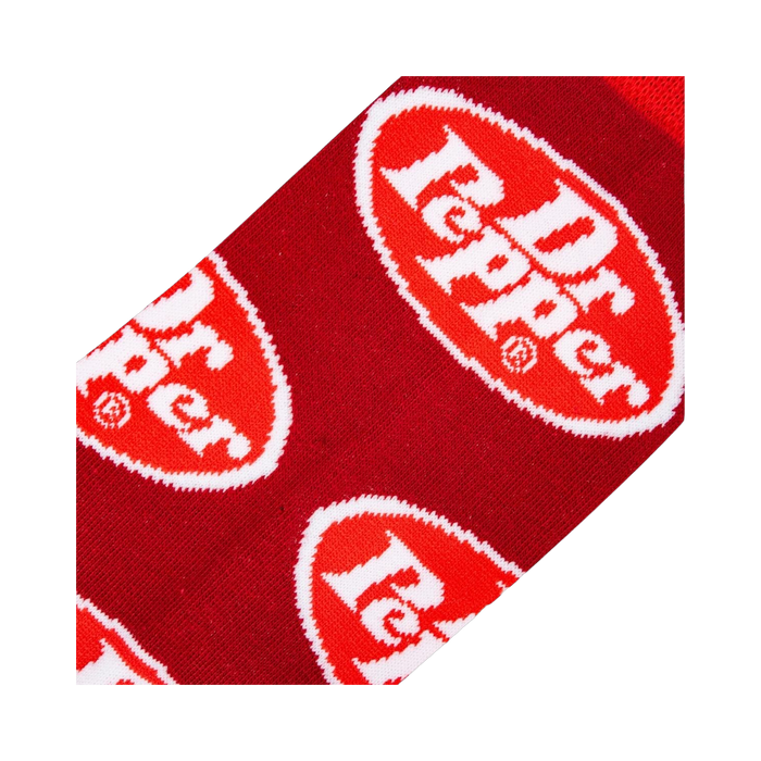 Close-up detail shot of the Dr Pepper logo on the red sock fabric.