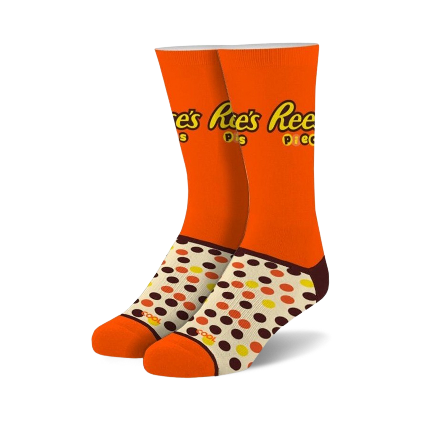 Pair of orange crew socks with Reese's Pieces logo and brown, yellow, and orange polka dots. 