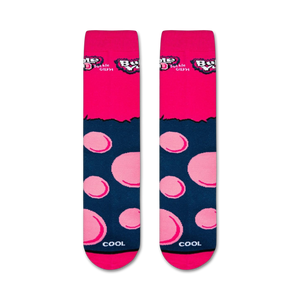 A pair of pink socks with a repeating pattern of light blue bubblegum balls and the word 