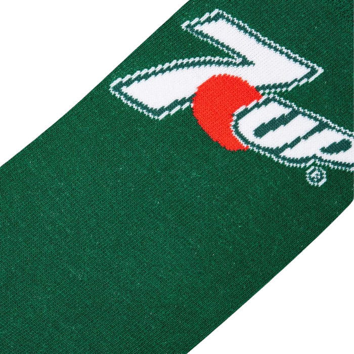 A close up of a green sock with a red circle and white 7UP logo.