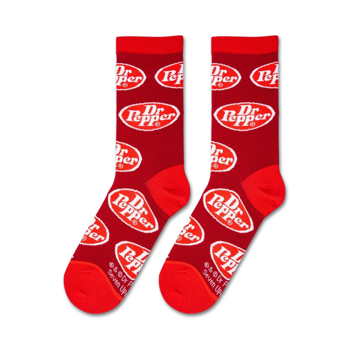 A close up of red socks with a white oval logo that says Dr. Pepper in white with a red outline.