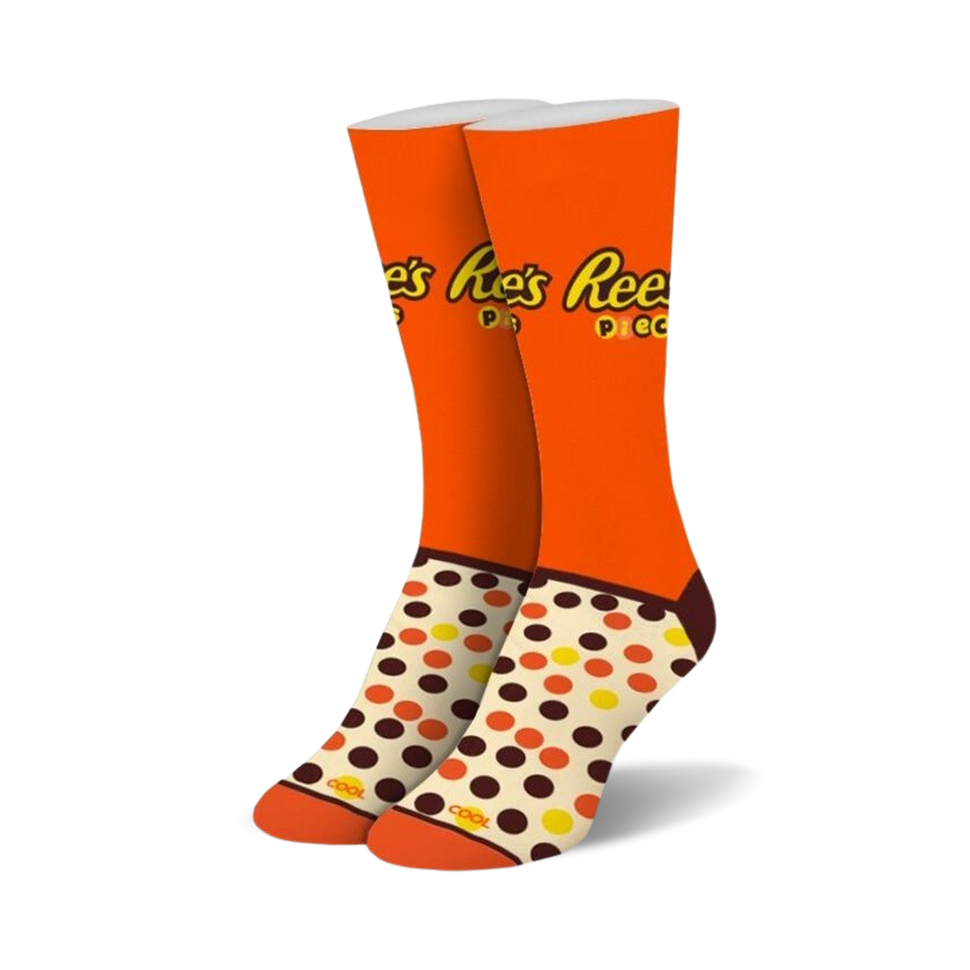 Pair of crew socks in orange, brown, and cream. Features Reese's Pieces logo and polka dot pattern.