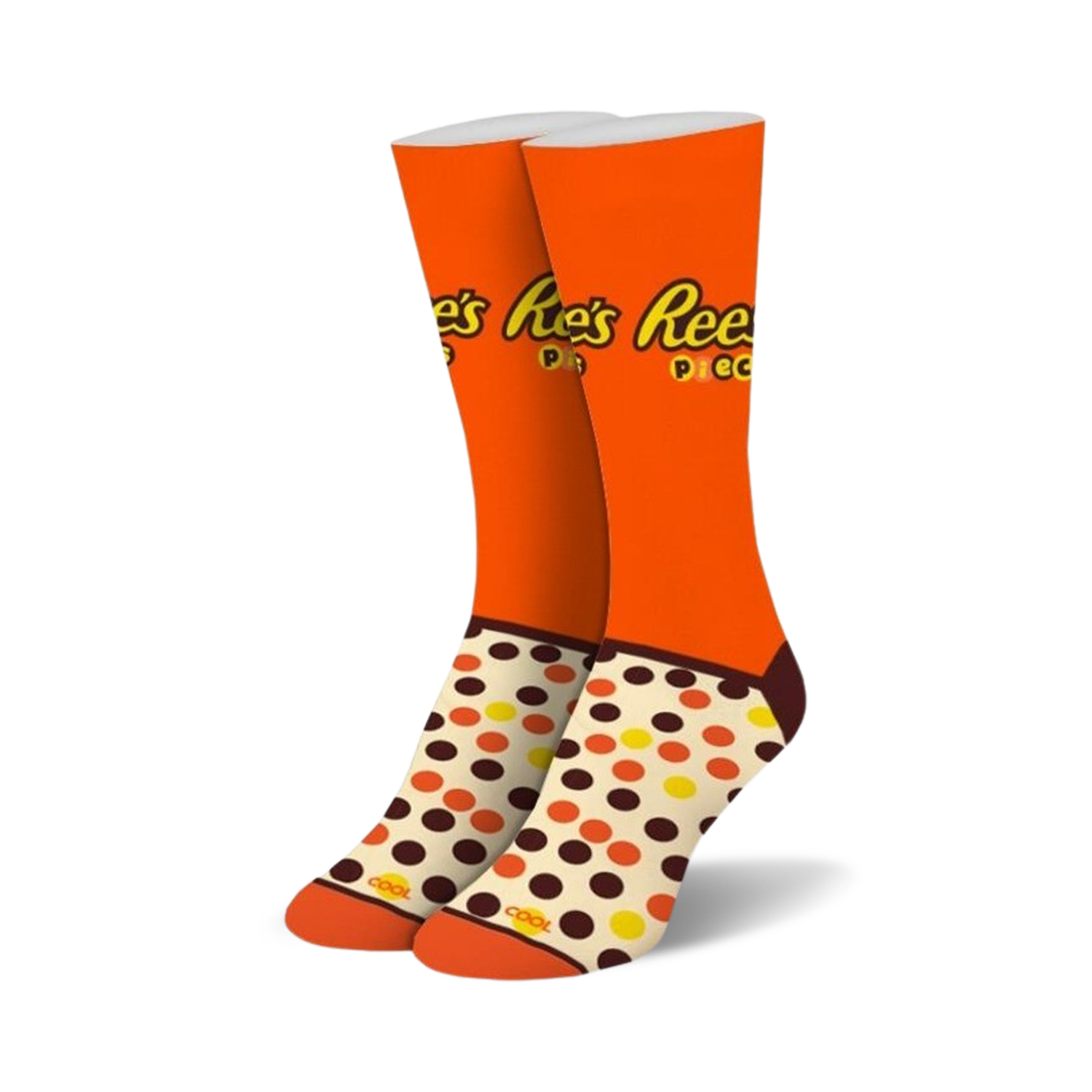 Pair of crew socks in orange, brown, and cream. Features Reese's Pieces logo and polka dot pattern.