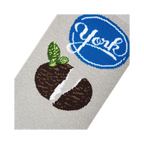 Close-up detail shot of the York Peppermint Pattie design on a grey sock, showing the texture and print quality.