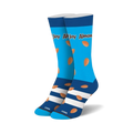 Pair of crew socks in blue and white with almond designs and 'Almond Joy' text.  Features a navy blue cuff and turquoise sole.