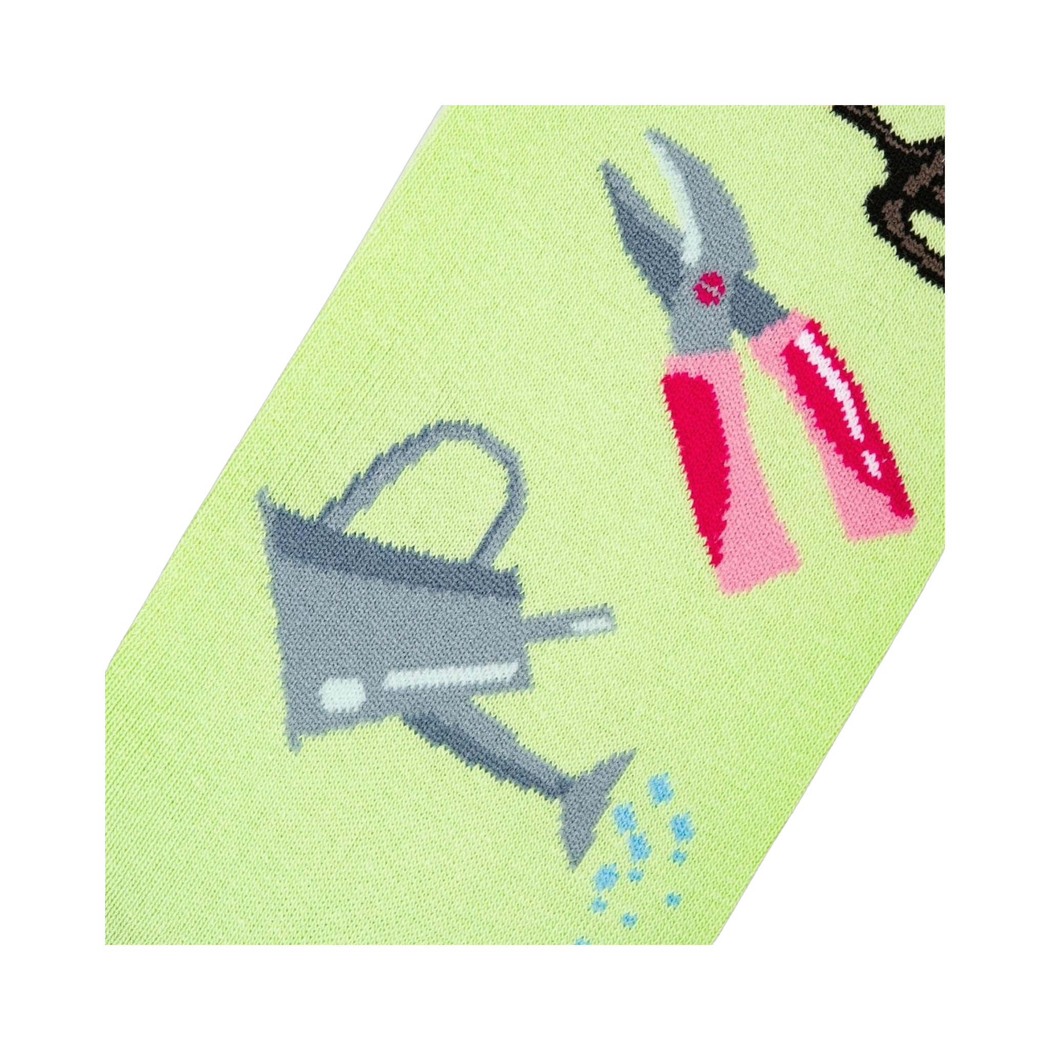 Detailed close-up of the sock design, focusing on a watering can and pink gardening shears.