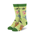 Pair of crew socks, light green background with gardening tools (watering can, shears, trowel) and flowers in pink and orange.