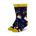 Pair of navy blue crew socks featuring gold scales of justice, gavels, and open books. The word 'Lawyer' is subtly incorporated into the design.