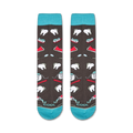 Flatlay showcasing the Dentist socks, highlighting the teal cuffs and full design.