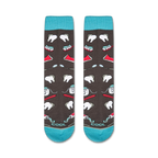 Flatlay showcasing the Dentist socks, highlighting the teal cuffs and full design.