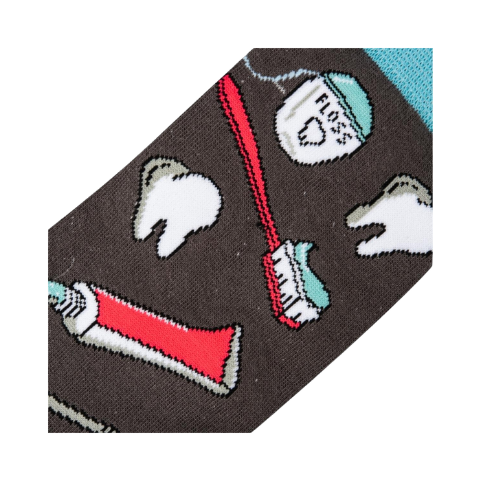 Close-up detail shot of the sock fabric, showing the crisp and detailed print of the dental tools and teeth.