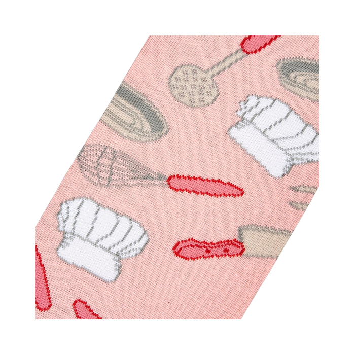 Close-up detail shot of the Chef sock fabric, highlighting the pink background and kitchen utensil pattern.