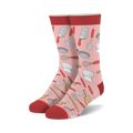 Pair of crew socks in pink, red, and cream.  Features a fun pattern of chef hats, whisks, spatulas, and other kitchen tools.