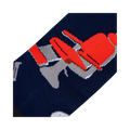 Close-up detail shot of the barber chair design on the socks.