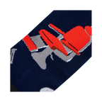 Close-up detail shot of the barber chair design on the socks.
