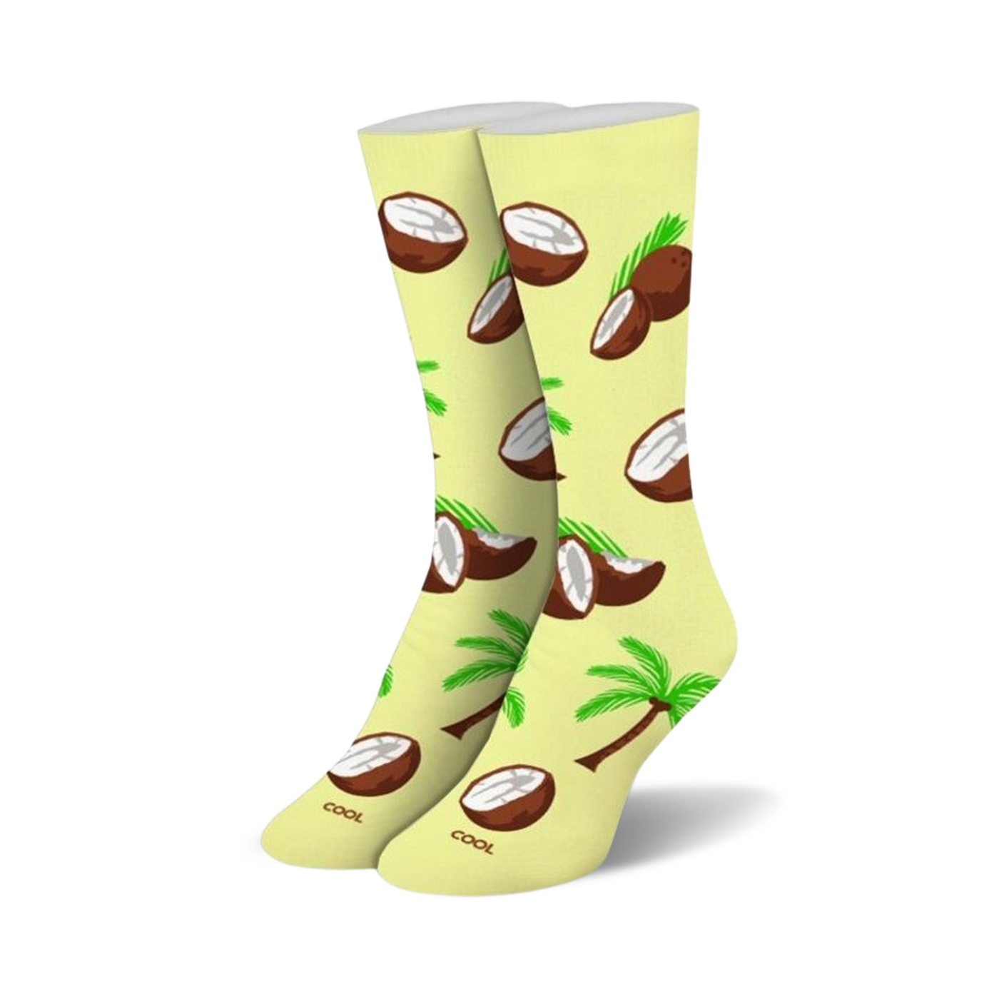Pair of pastel yellow crew socks featuring a fun pattern of brown coconuts, coconut halves, and green palm trees.