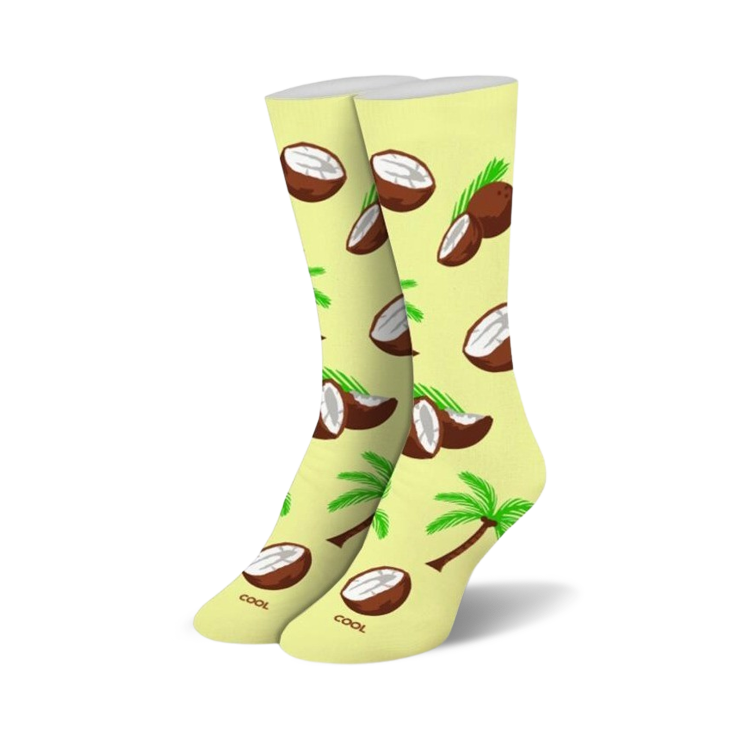 Pair of pastel yellow crew socks featuring a fun pattern of brown coconuts, coconut halves, and green palm trees.
