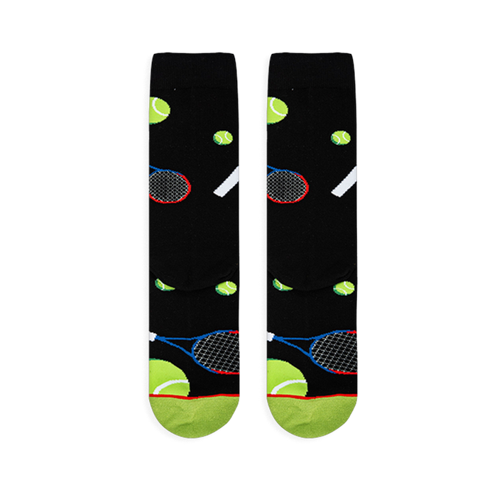 Flat lay of black socks showing the tennis ball and racket pattern, with a neon green toe and red stripe at the bottom.